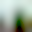 Singapore Green Building Certifications: A stunning indoor waterfall cascades over a lush, green mountain surrounded by glass architecture, creating a vibrant tropical oasis.